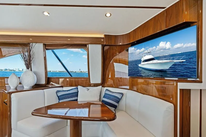 Lollipop Yacht Photos Pics Luxurious interior of 2022 Viking 48 Convertible yacht with elegant seating and ocean view.