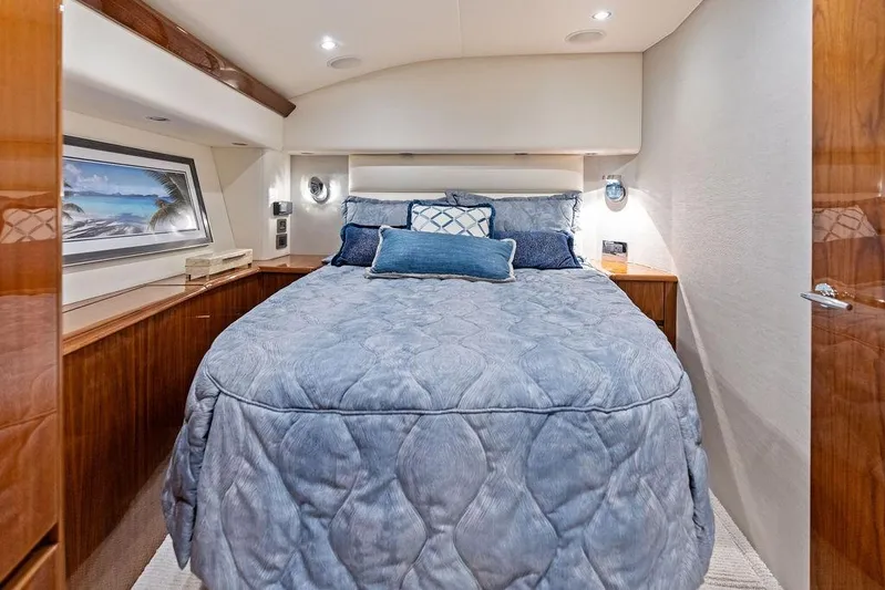 Lollipop Yacht Photos Pics Luxurious bedroom interior of 2022 Viking 48 Convertible yacht with elegant bedding.