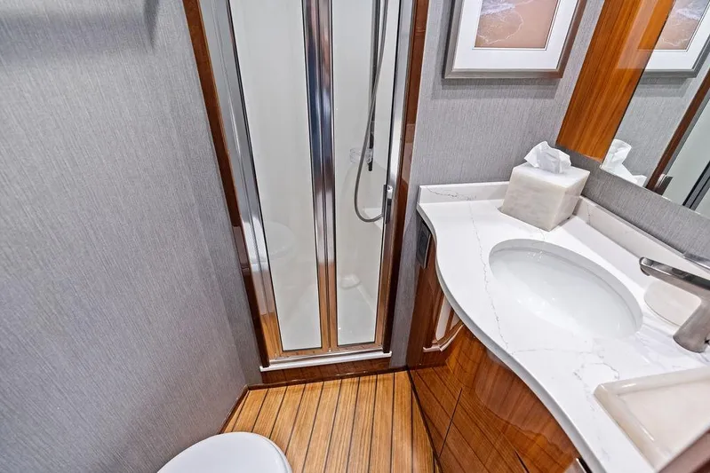 Lollipop Yacht Photos Pics Luxurious bathroom in 2022 Viking 48 Convertible yacht with modern fixtures and elegant design.