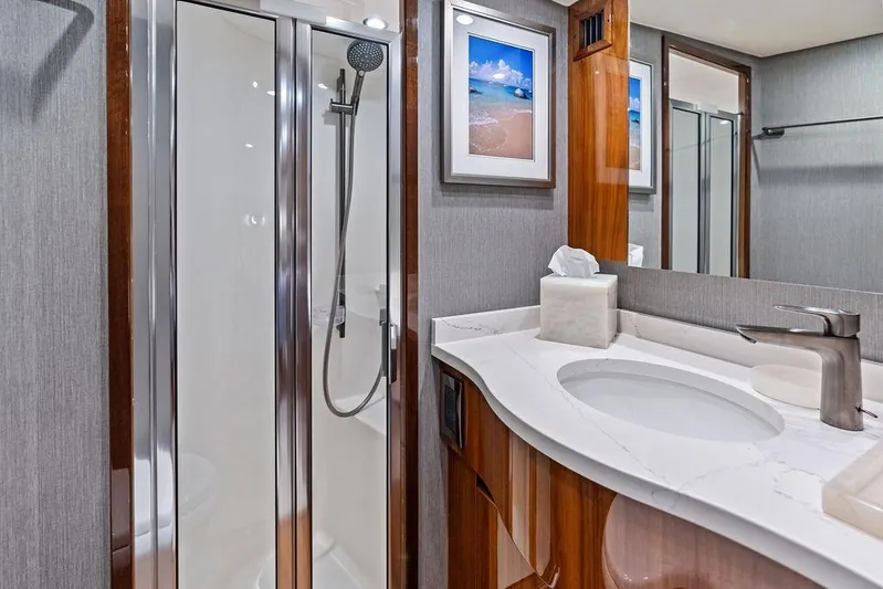 Lollipop Yacht Photos Pics Luxurious bathroom in 2022 Viking 48 Convertible yacht with modern shower and elegant vanity.