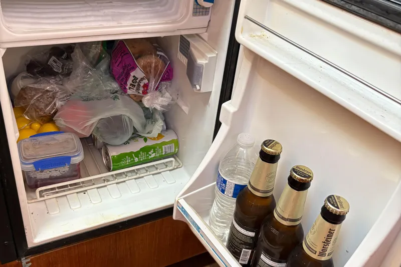 Kokua Yacht Photos Pics Refrigerator interior with assorted groceries and drinks on a Hunter 33, 2004 model.