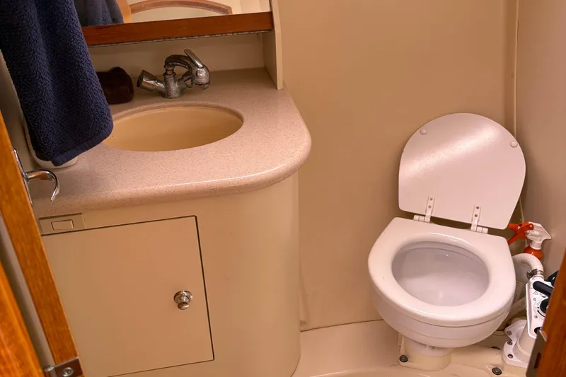 Kokua Yacht Photos Pics Compact bathroom in 2004 Hunter 33 yacht with sink and toilet.