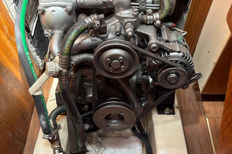 Kokua Yacht Photos Pics Engine of a 2004 Hunter 33 sailboat with visible belts and hoses.