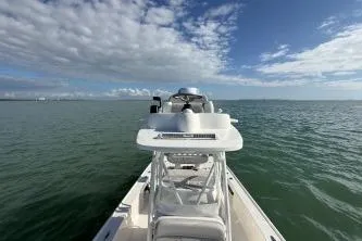  Yacht Photos Pics 2024 SeaVee 270Z boat on open water under a partly cloudy sky.