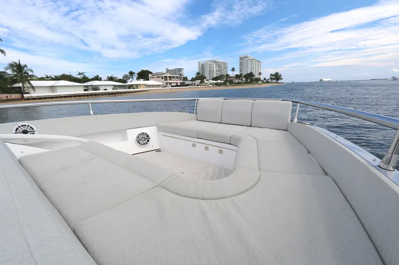 Momentum Yacht Photos Pics Luxurious seating area on 2023 Azimut 47 VERVE yacht, with ocean and cityscape views.