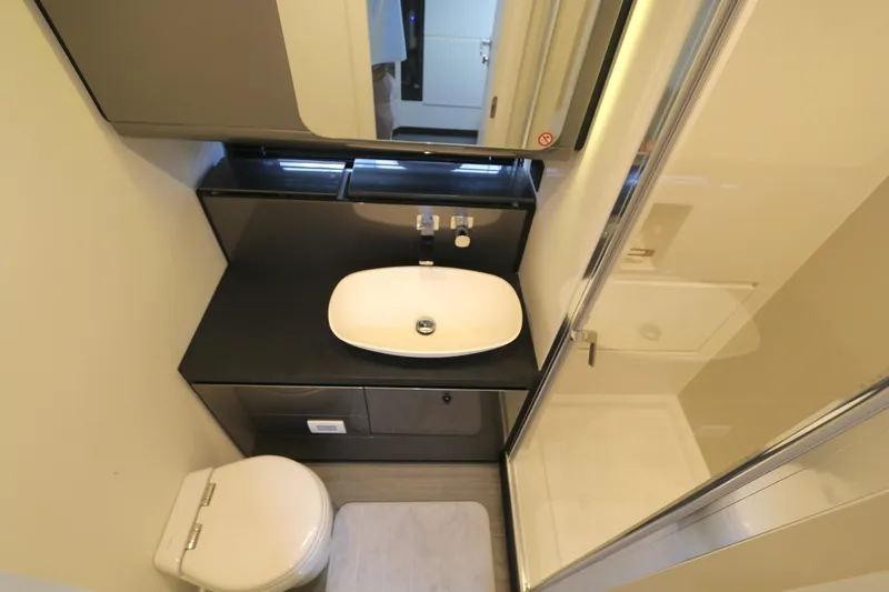 Momentum Yacht Photos Pics Modern bathroom in 2023 Azimut 47 VERVE yacht with sleek sink and shower.
