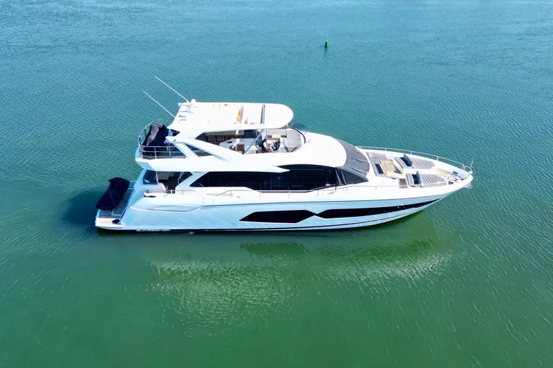  Yacht Photos Pics 2018 Sunseeker 76 Yacht cruising on calm blue waters.