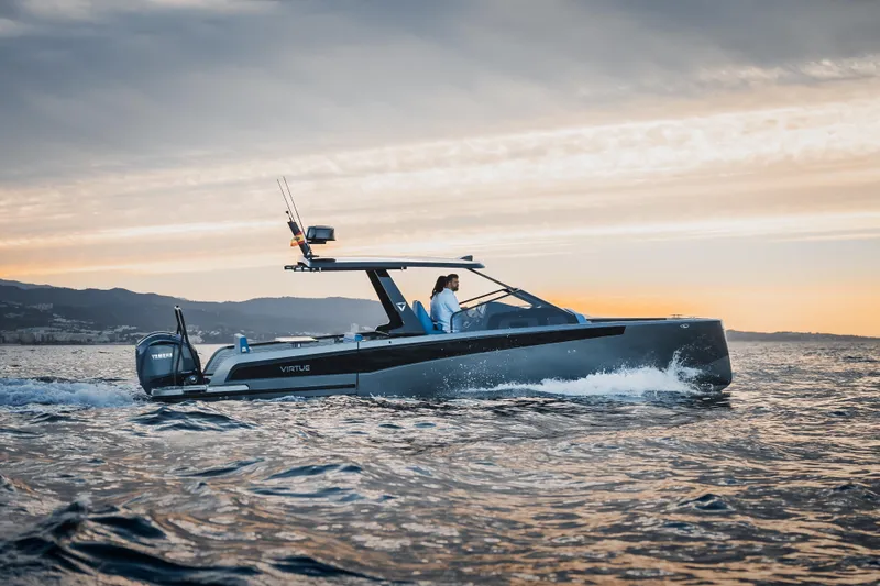  Yacht Photos Pics 2026 Virtue V10 T-Top boat cruising at sunset on open water.