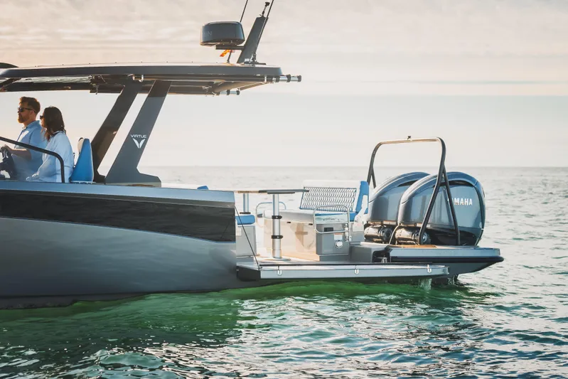  Yacht Photos Pics 2026 Virtue V10 T-Top boat on water, featuring Yamaha engines, sleek design.
