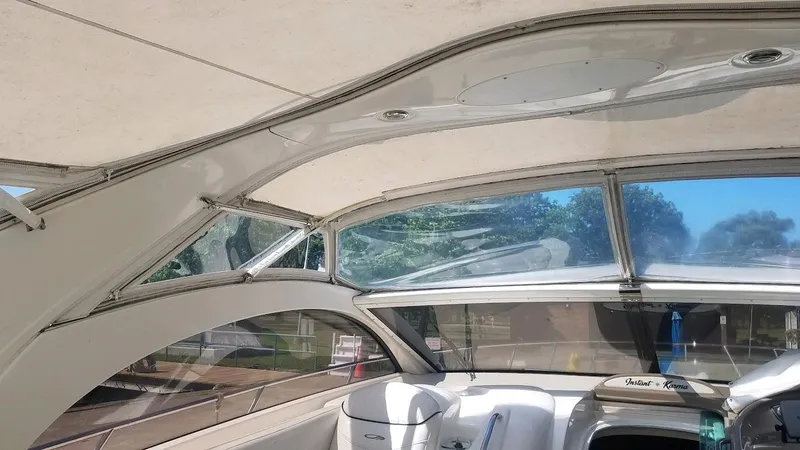 Instant Karma Yacht Photos Pics Interior view of 2002 Maxum 4200 SY yacht with large windows and seating.