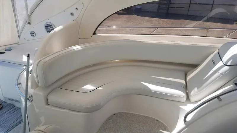 Instant Karma Yacht Photos Pics 2002 Maxum 4200 SY yacht interior with curved seating and elegant design.