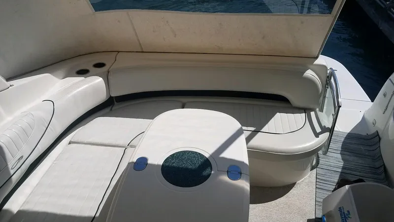Instant Karma Yacht Photos Pics Interior seating area of 2002 Maxum 4200 SY yacht with beige upholstery.