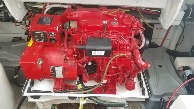 Instant Karma Yacht Photos Pics Red engine of a 2002 Maxum 4200 SY boat, detailed view.