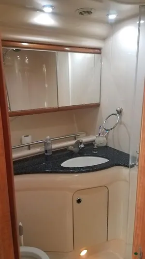 Instant Karma Yacht Photos Pics Luxurious bathroom in 2002 Maxum 4200 SY yacht with modern fixtures and sleek design.