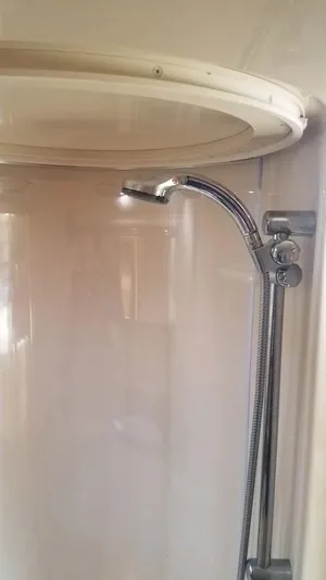 Instant Karma Yacht Photos Pics Shower area in 2002 Maxum 4200 SY yacht, featuring chrome fixtures.