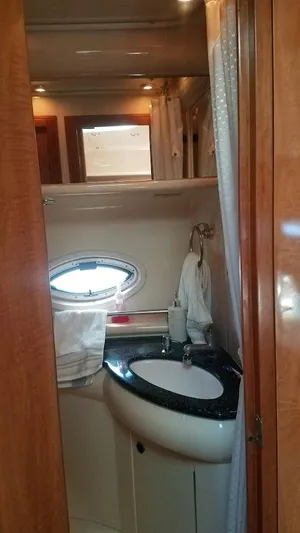 Instant Karma Yacht Photos Pics 2002 Maxum 4200 SY yacht bathroom with sink and porthole window.