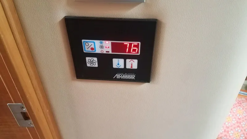 Instant Karma Yacht Photos Pics Digital thermostat display on 2002 Maxum 4200 SY yacht, showing 76 degrees.