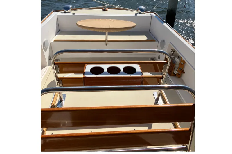 Virginia Yacht Photos Pics 2010 C.W. Hood WASQUE 26 boat interior with wooden accents and seating area.