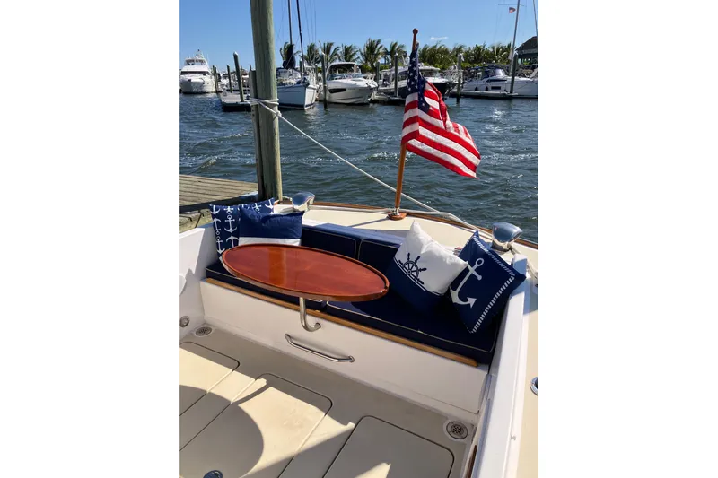 Virginia Yacht Photos Pics C.W. Hood WASQUE 26 boat, 2010 model, with nautical-themed cushions and American flag.