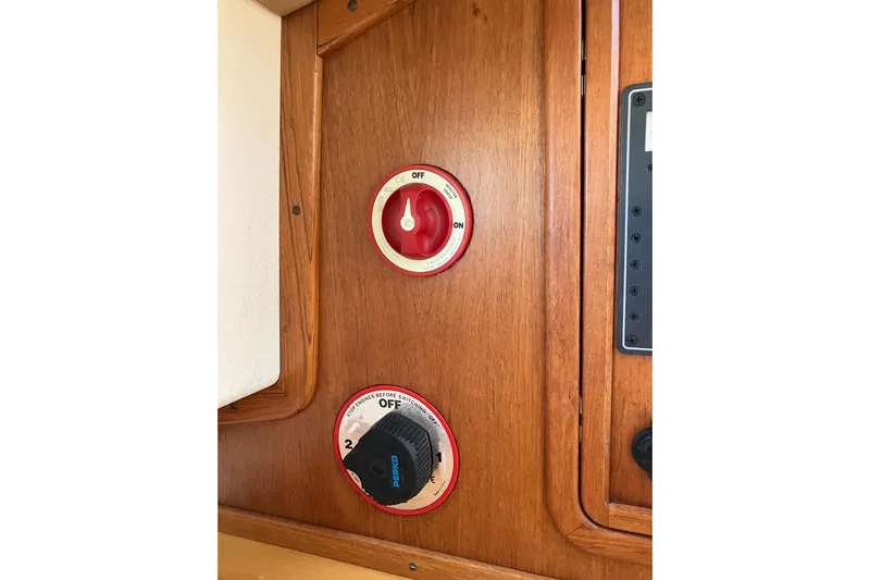 Virginia Yacht Photos Pics Control panel of 2010 C.W. Hood WASQUE 26 boat with switches on wooden surface.