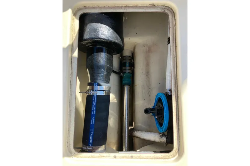 Virginia Yacht Photos Pics Engine compartment of 2010 C.W. Hood WASQUE 26 boat, showing hoses and fittings.