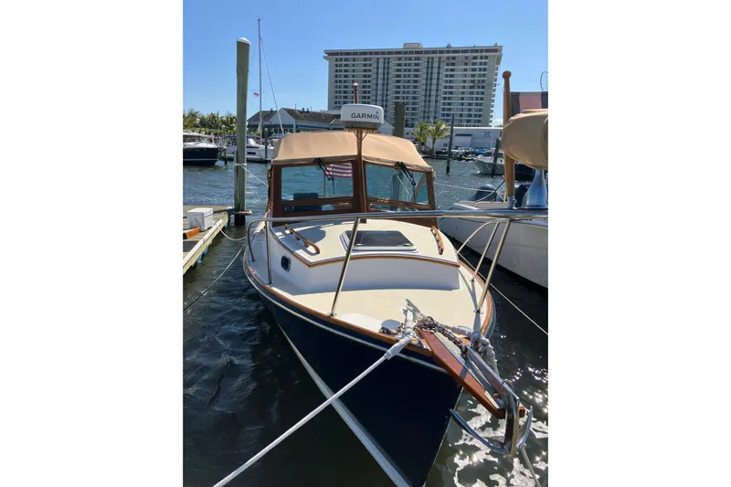 Virginia Yacht Photos Pics 2010 C.W. Hood WASQUE 26 boat docked at marina with building in background.