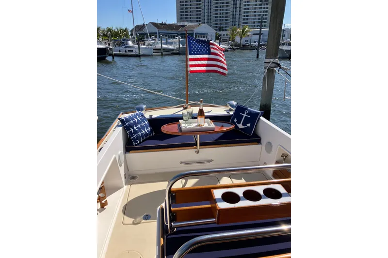 Virginia Yacht Photos Pics C.W. Hood WASQUE 26 boat, 2010 model, with American flag and nautical-themed cushions.