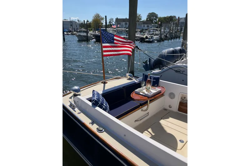 Virginia Yacht Photos Pics C.W. Hood WASQUE 26 boat, 2010 model, docked with American flag and nautical decor.