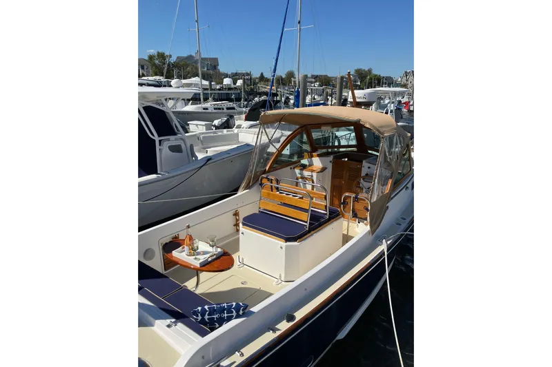 Virginia Yacht Photos Pics Elegant 2010 C.W. Hood WASQUE 26 boat docked, featuring a stylish interior and outdoor seating.