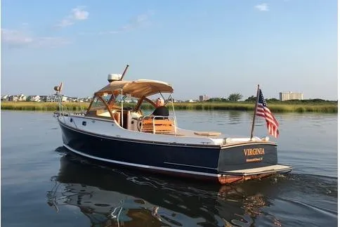 Virginia Yacht Photos Pics 2010 C.W. Hood WASQUE 26 boat on calm water, American flag, scenic background.