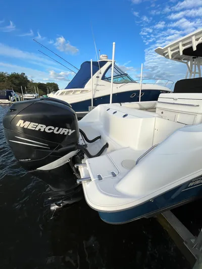  Yacht Photos Pics 2011 Boston Whaler 320 Outrage Cuddy Cabin with Mercury outboard engine.