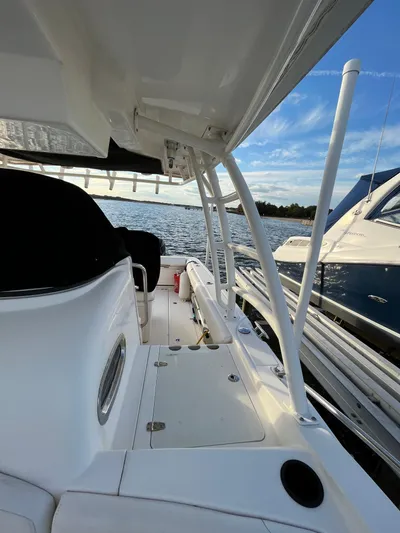  Yacht Photos Pics 2011 Boston Whaler 320 Outrage Cuddy Cabin on calm waters.
