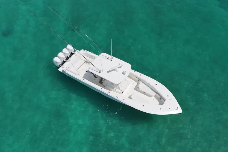  Yacht Photos Pics 2022 SeaVee 390Z boat on clear turquoise water, aerial view.