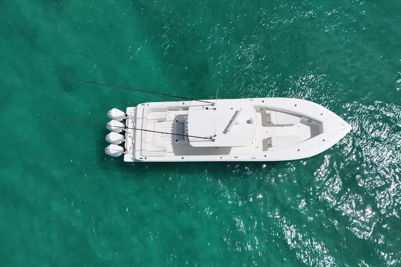  Yacht Photos Pics Aerial view of 2022 SeaVee 390Z boat on clear turquoise water.