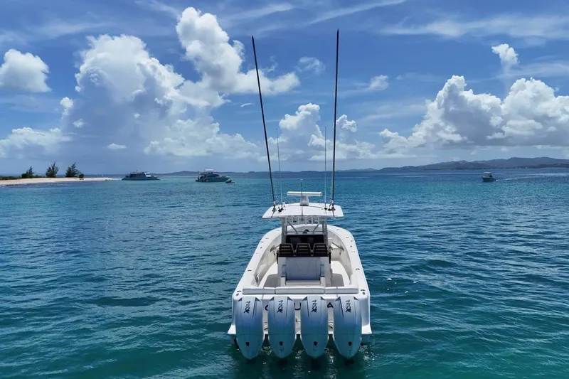  Yacht Photos Pics 2022 SeaVee 390Z boat on clear blue ocean under a bright sky.