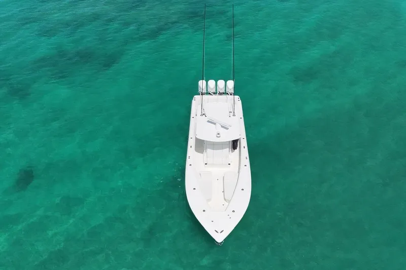  Yacht Photos Pics Aerial view of 2022 SeaVee 390Z boat on clear turquoise water.