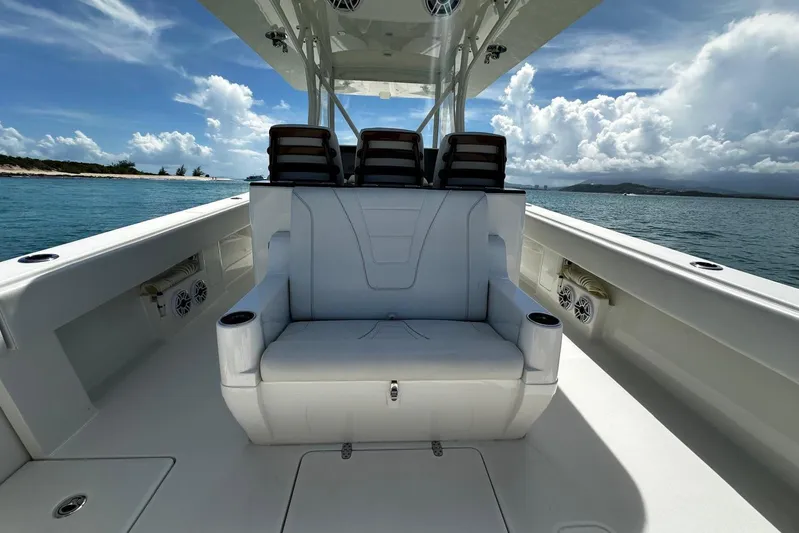  Yacht Photos Pics 2022 SeaVee 390Z boat interior with seating, ocean view, and clear sky.
