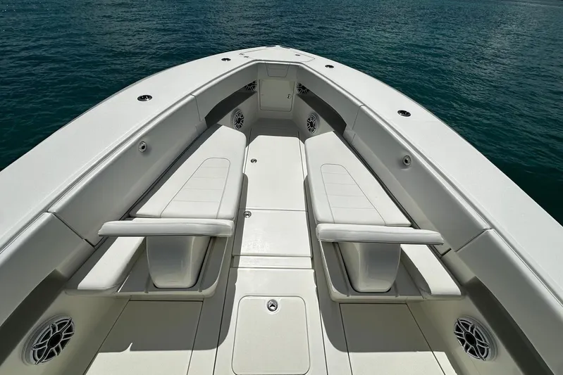  Yacht Photos Pics 2022 SeaVee 390Z boat interior with cushioned seating and ocean view.