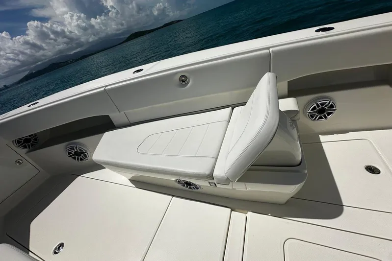  Yacht Photos Pics 2022 SeaVee 390Z boat interior with white seating and ocean backdrop.