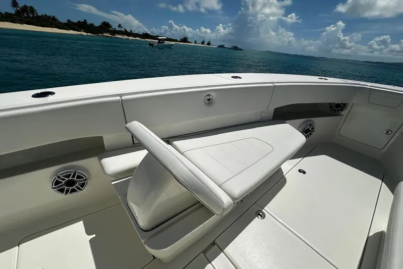  Yacht Photos Pics 2022 SeaVee 390Z boat interior with seating, ocean view, and clear skies.