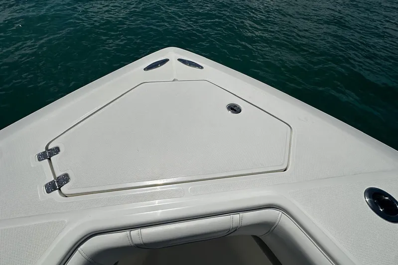  Yacht Photos Pics Bow of 2022 SeaVee 390Z boat with storage hatch, on calm water.
