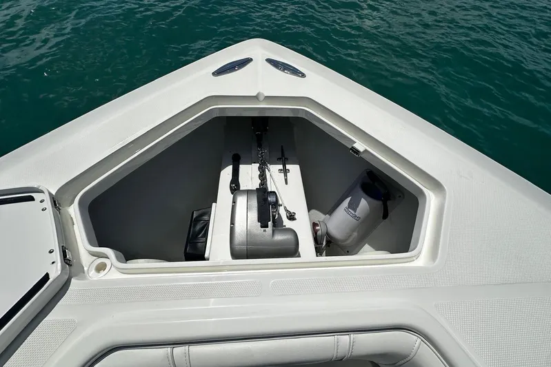  Yacht Photos Pics Bow storage compartment of 2022 SeaVee 390Z boat, featuring anchor and equipment.