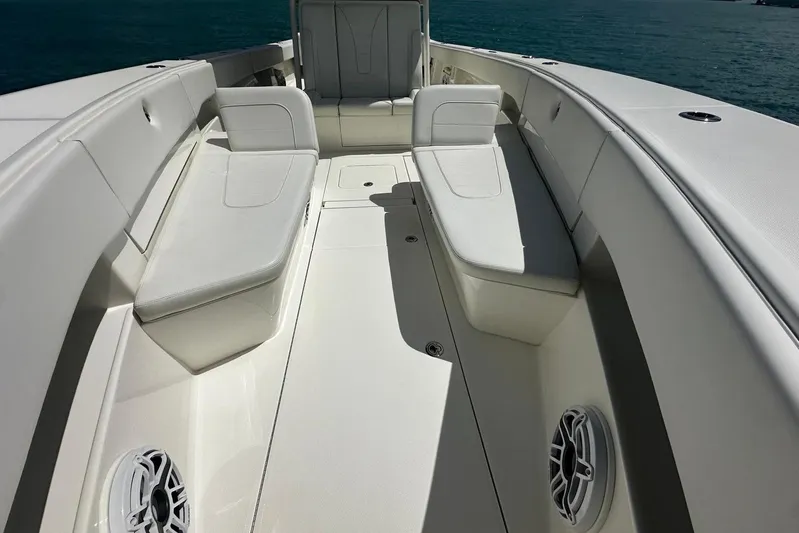  Yacht Photos Pics 2022 SeaVee 390Z boat interior with white seating and ocean backdrop.