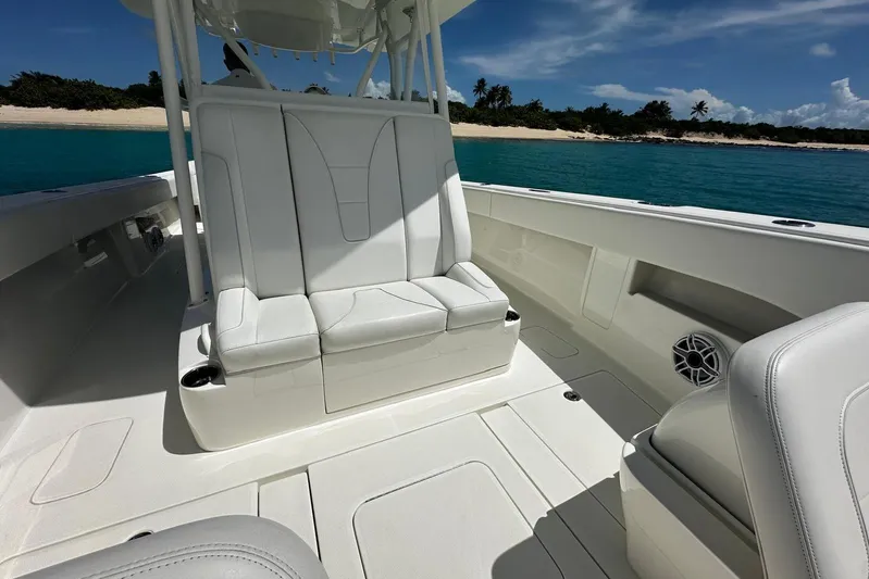  Yacht Photos Pics 2022 SeaVee 390Z boat interior with white seating, ocean view, and clear sky.