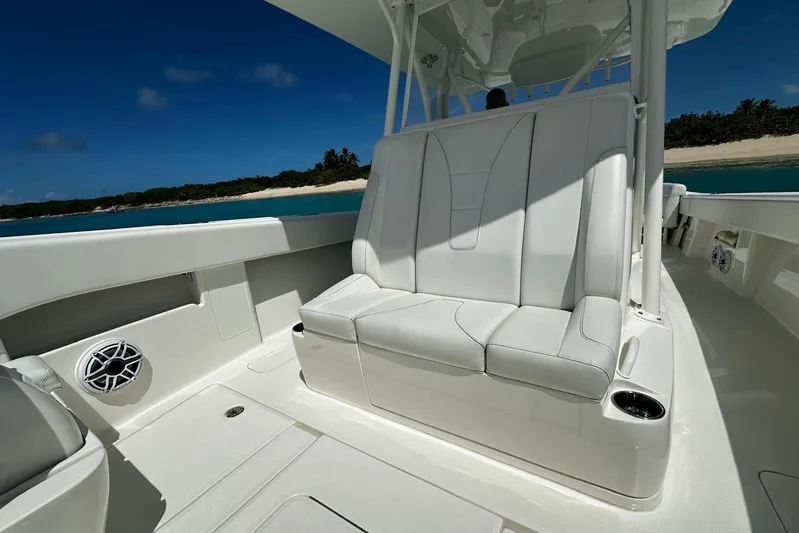  Yacht Photos Pics 2022 SeaVee 390Z boat interior with white seating, ocean view, and clear blue sky.