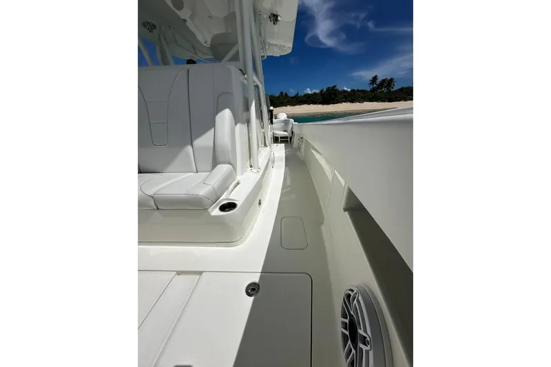  Yacht Photos Pics 2022 SeaVee 390Z boat interior with white seating, ocean view, and clear blue sky.