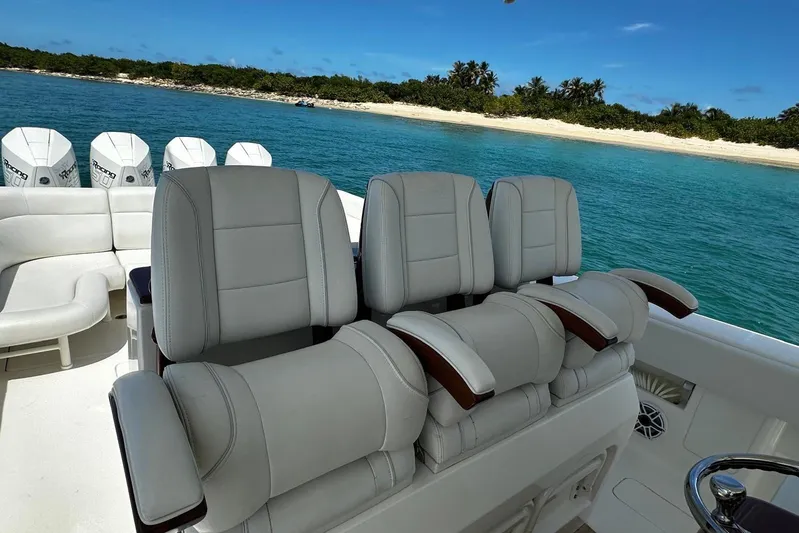  Yacht Photos Pics 2022 SeaVee 390Z boat interior with luxurious seating, ocean view, and multiple engines.