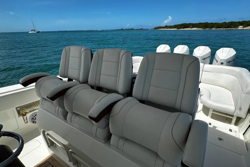  Yacht Photos Pics Luxurious seating on 2022 SeaVee 390Z boat with ocean backdrop.