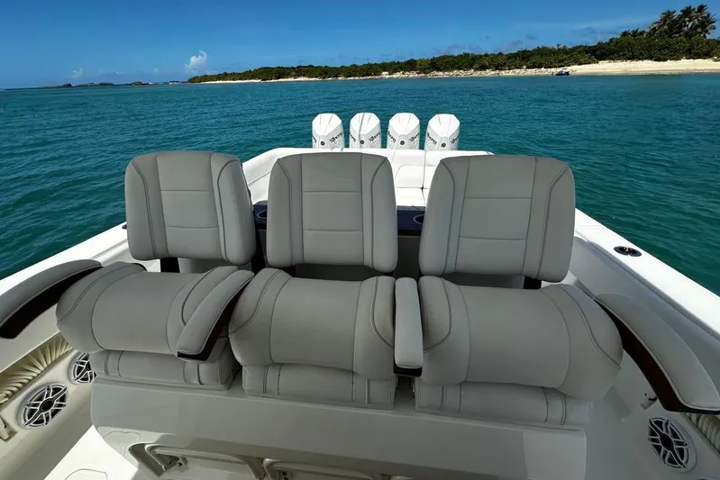  Yacht Photos Pics 2022 SeaVee 390Z boat with luxurious seating, ocean view, and powerful engines.