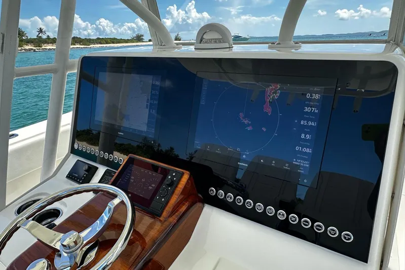  Yacht Photos Pics 2022 SeaVee 390Z boat dashboard with advanced navigation system and steering wheel.